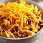 Close-up of crock pot beef noodle casserole with creamy sauce and beef chunks