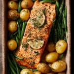 Close-up of a deliciously cooked sheet pan salmon with vibrant vegetables