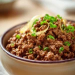 Close-up of slow cooker beef with ground beef in a rich sauce