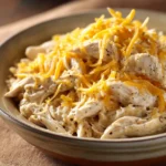 Close-up of slow cooker chicken ranch dish with creamy sauce and herbs