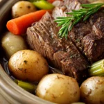 Close-up of a slow cooker pot roast with carrots and potatoes, showcasing a hearty meal.